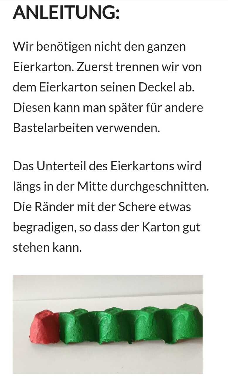 Bunter Eierkarton mit rotem und gr&uuml;nen Bereich, auf einem wei&szlig;en Tisch liegend, f&uuml;r Bastelarbeiten vorbereitet.