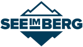 Logo der Marke "SEEL im BERG" mit stilisierten Bergen und Text in blauer Schrift auf weißem Hintergrund.